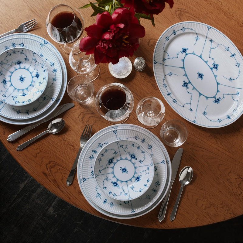 Royal Copenhagen | Blue Fluted Plain Plate, 27cm, elegantly set on a wooden table with matching porcelain and polished flatware, ideal for formal dining.