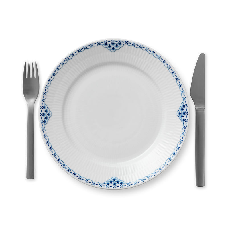 Royal Copenhagen | Princess Plate, 22cm, features a hand-painted blue scalloped border, shown with a fork and knife, embodying classic femininity and elegance.