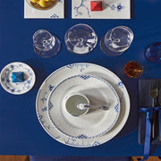 Royal Copenhagen Princess Plate, 22cm, elegantly set with matching soup cup and spoon, embodies classic femininity with hand-painted blue flutes and lace border.