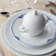 Royal Copenhagen | Princess Plate, 22cm, with hand-painted blue scalloped border, atop a formal setting with a lidded bowl and spoon, ideal for elegant dining.