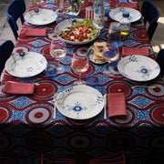 Royal Copenhagen | Blue Mega Plate, 27cm, Dec. No.6, set on a colorful dining table, surrounded by a casual meal setting for six.