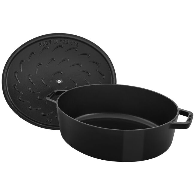 Staub | Wide Oval Dutch Oven - Graphite Grey: A 6.25-quart enameled cast iron pot with a self-basting lid, ideal for roasting and baking, enhancing cooking results.