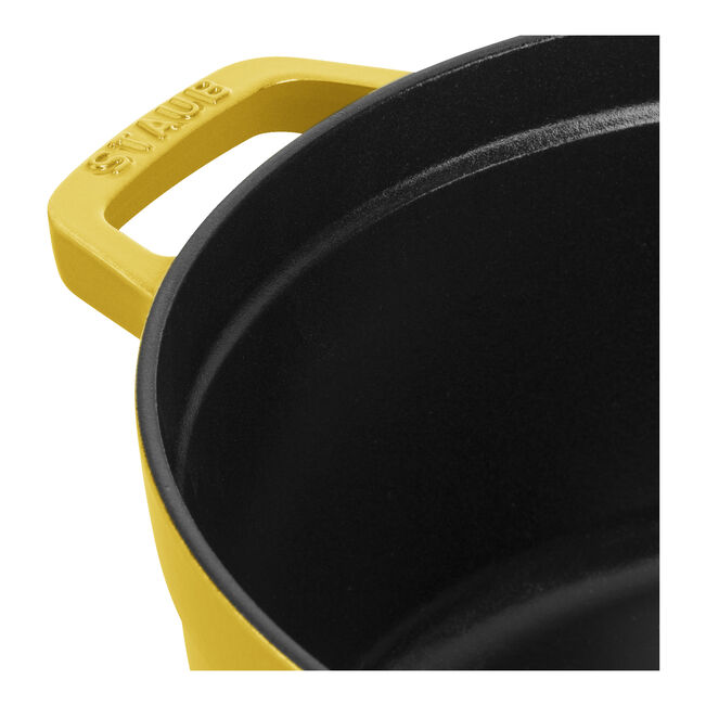 Staub | Round Cocottes - 5.5 qt Citron, featuring citron finish, black interior, and STAUB-marked handle, ideal for braising and roasting with self-basting Chistera lid.