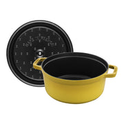 Staub | Round Cocottes - 4 qt Citron: Yellow-enameled cast-iron Dutch oven with black interior and self-basting lid, handcrafted in France, ideal for slow-cooking.