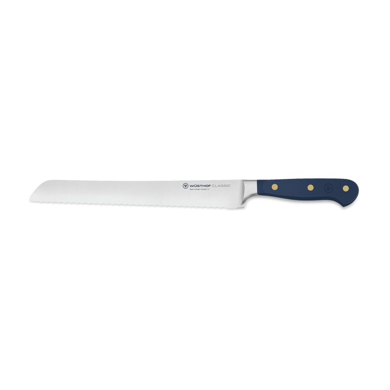 Wüsthof | Classic 9 Precision Double-Serrated Bread Knife with serrated edge and three-riveted handle, ideal for slicing artisan loaves and versatile kitchen use.