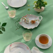 Royal Copenhagen Spring 2026 Eggs Poppy 6cm 2pc displayed on a spring table setting with decorative elements like a teacup, glass tumblers, and floral accents.