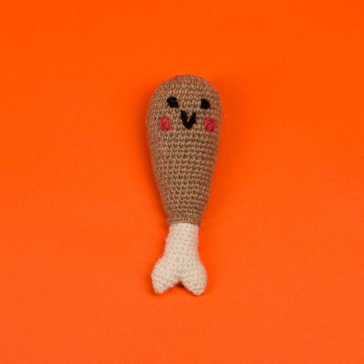 Ware of the Dog - Hand Knit Drumstick Dog Toy, a fair-trade amigurumi crochet toy with a kawaii face, crafted from 100% lambswool by Nepalese artisans.
