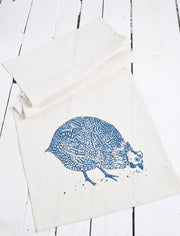 Hearth and Harrow - Organic Cotton Guinea Hen Tea Towel in Navy Blue displayed on a white surface, featuring a screen-printed guinea fowl design, ideal for a stylish kitchen.