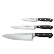 Wüsthof | Three Classic series kitchen knives showcasing paring, utility, and chef’s blades with full-tang, triple-riveted handles, ideal for versatile culinary tasks.