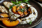 Giusti - 1 Silver Medal Balsamic Vinegar drizzled over ricotta cheese with grilled peaches, herbs, and flatbread, showcasing its versatile culinary pairing.