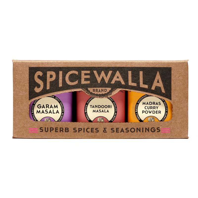 Spicewalla | Masala Collection Gift Set featuring Garam Masala, Tandoori Masala, and Madras Curry Powder tins showcased in a die-cut windowed box.
