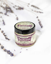 Roots And Leaves - Magnesium Body Butter jar with purple flowers, designed for topical magnesium absorption, aiding sleep, pain relief, and muscle relaxation.