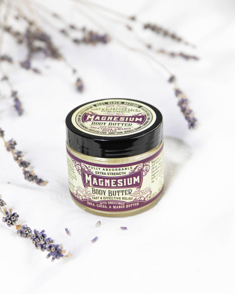 Roots And Leaves - Magnesium Body Butter jar with purple flowers, designed for topical magnesium absorption, aiding sleep, pain relief, and muscle relaxation.