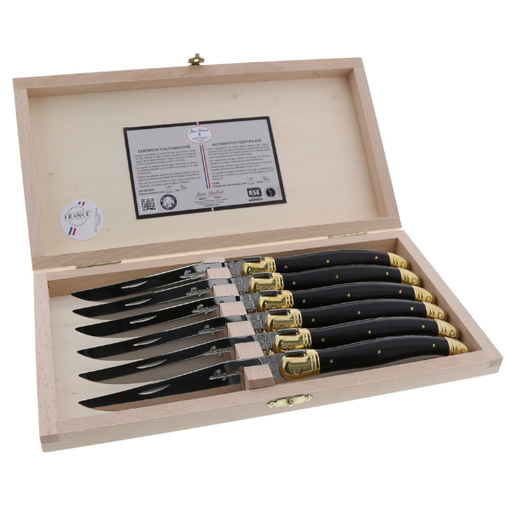 The French Farm - Jean Dubost 6 Steak Knives Black & Brass handles Clasp Box displayed open, showcasing knives with black handles and brass accents, inside a wooden presentation box.