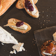 Beth's Farm Kitchen Golden Pear Chutney on crostini with creamy cheese, perfect for enhancing any cheese board or dish. Available in 6 jars.