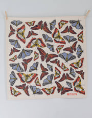 Hearth and Harrow - Butterfly Tea Towel: Organic cotton towel with red, yellow-cream, black, and blue butterfly pattern, clipped at corners. Eco-friendly, 30x30, designed in Rockport, Maine.