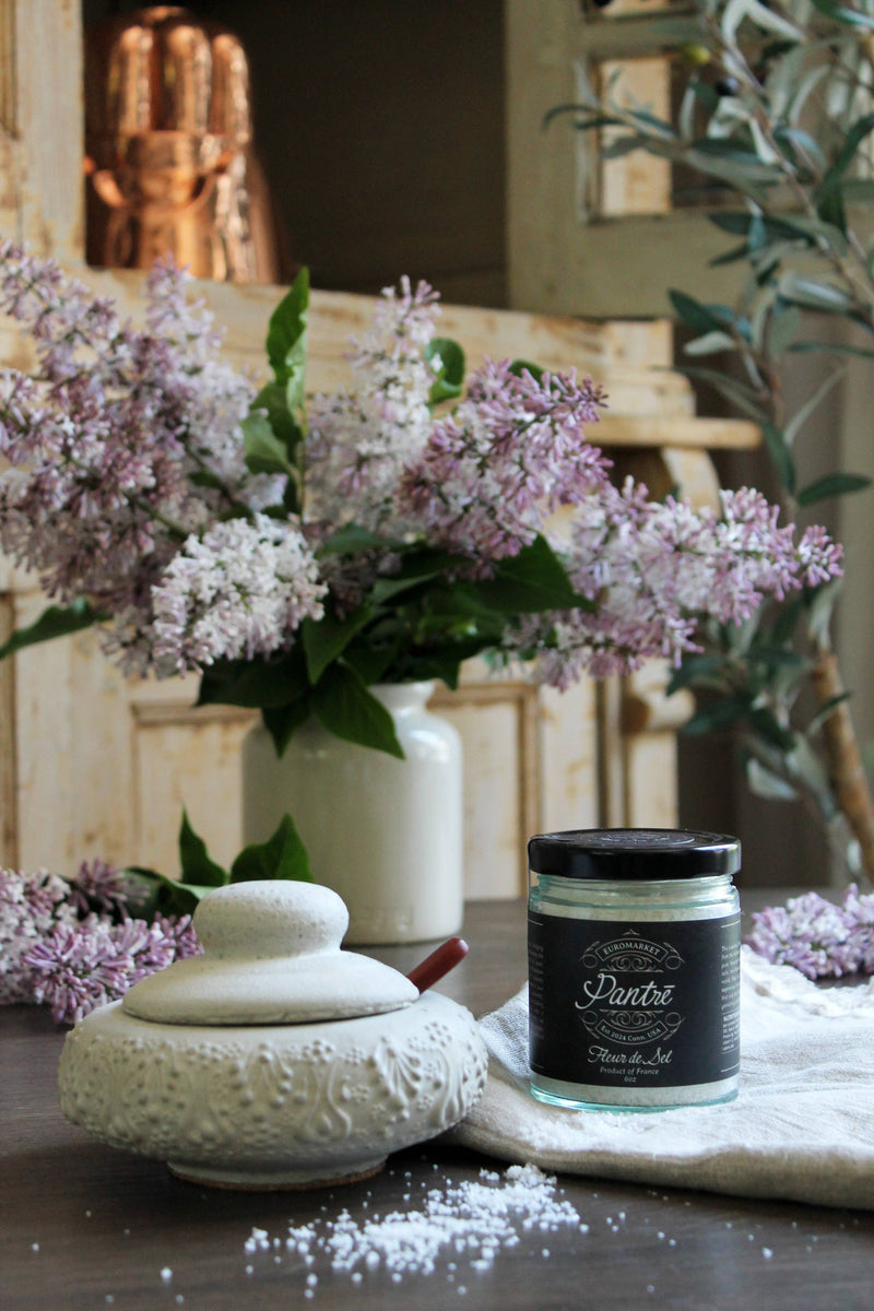 Vintage Inspired French Salt Cellar by Coppermill Kitchen LLC on wooden tabletop, paired with Pantre Fleur de Sel, soft linen, lilac vase, and rustic decor.
