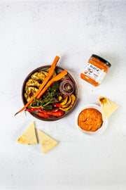 Matiz Romesco - 6.5oz with grilled vegetables, flatbread, and a jar of Matiz España Romesco Tradicional Sauce, perfect for dipping and enhancing Mediterranean dishes.