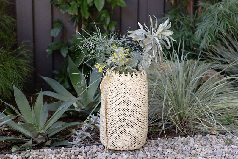 NEEPA HUT - Hanging Storage basket: A woven bamboo/rattan cone-shaped basket, ideal for holding yoga mats, produce, or decoratively storing household items.