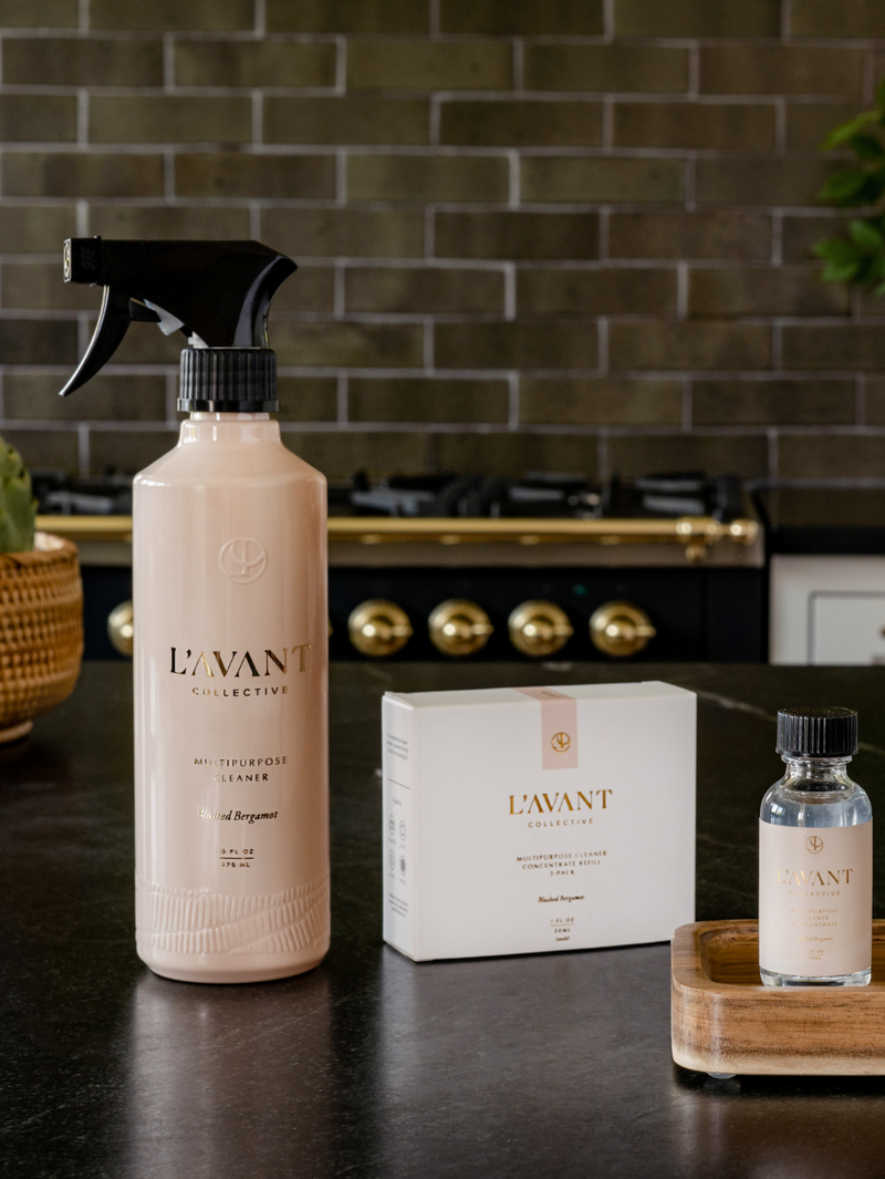 L'AVANT Collective - Multipurpose Concentrate Refill Pack of 3 Blushed Bergamot on a dark countertop, perfect for eco-friendly cleaning in your Athens Cooks kitchen.