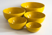 RachaelPots - Nesting Bowls Set Of Five: Light Blue, featuring yellow ceramic bowls with speckled design, hand-trimmed foot, ideal for versatile kitchen use.