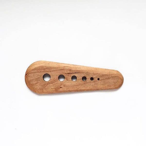 Collin Garrity - Herb Stripper: Cherry, a handcrafted wooden tool with circular holes for stripping herbs, also scrapes seeds. Made in St. Louis, USA.