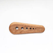 Collin Garrity - Herb Stripper: Walnut, featuring a series of circular holes for sizing herbs; ideal for removing greens and scraping seeds.