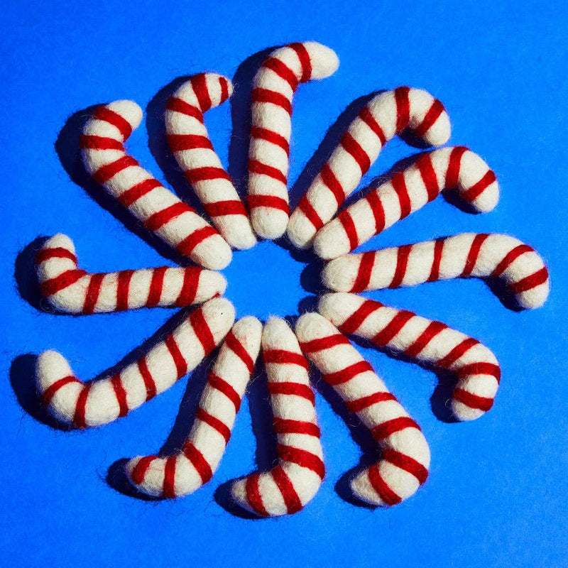 Ware of the Dog - Wool Candy Cane Cat Toy: A circular arrangement of felt candy-cane shapes filled with catnip, providing fair trade employment to Nepali craftswomen.