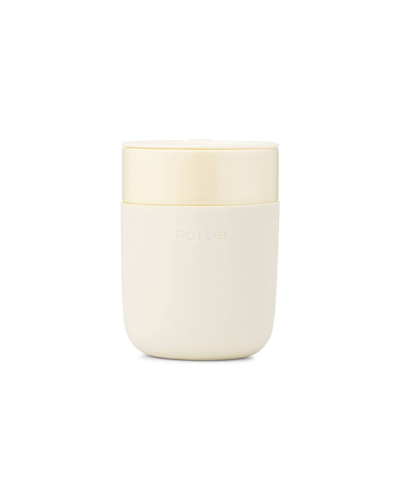 Reusable Ceramic Mug with white lid, designed for reducing waste. Features a splash-resistant lid, durable ceramic, and soft-touch silicone sleeve. Ideal for home-brewed beverages.