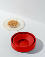 W&P | Popcorn Popper Silicone Reusable Maker - Personal Mini Red displayed fully expanded, showcasing its lid as a measuring cup for easy popcorn preparation.