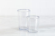 Zwiesel Fortessa Veranda Double Old Fashioned Clear 14oz Tumbler displayed on a countertop, highlighting its rustic, mouth-blown glass appearance in durable polycarbonate.