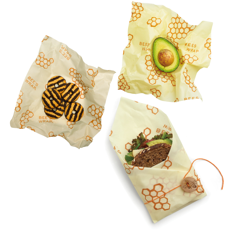 Bee's Wrap - Lunch 3 Pack - Honeycomb Print featuring reusable sandwich and snack wraps on a table, emphasizing sustainable food storage.