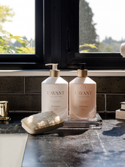 L'AVANT Collective - High Performing Dish Soap - Blushed Bergamot in a matte white bottle, displayed elegantly on a kitchen counter with other soap products.