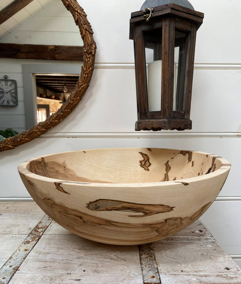 Petermans Boards and Bowls Inc. 15 Ambrosia Maple Round Bowl, handcrafted with unique beetle-patterned wood, perfect for serving meals, reflecting natural elegance and sustainability.