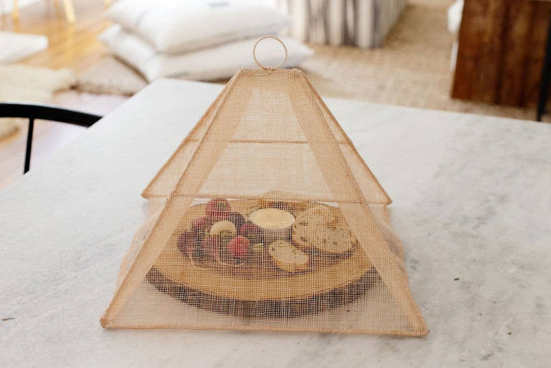 Handmade collapsible woven food tent by NEEPA HUT, featuring a unique pentagon shape, perfect for outdoor meals, crafted from abaca fiber.