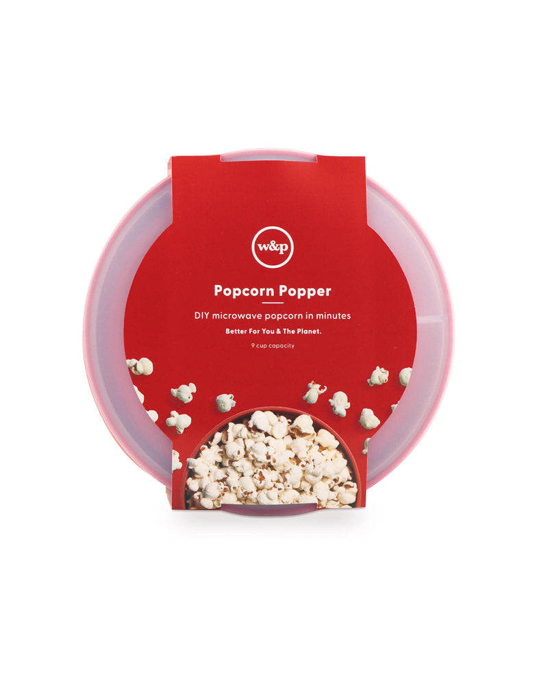 W&P - Standard Size Popcorn Popper: Red silicone container with red lid, filled with popcorn, showcasing reusable microwave-safe design for homemade popcorn.