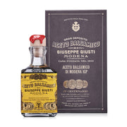Giusti - 4 Gold Medals Quarto Centenario Balsamic Vinegar in vintage-styled bottle and box with red wax seal, showcasing historic excellence.