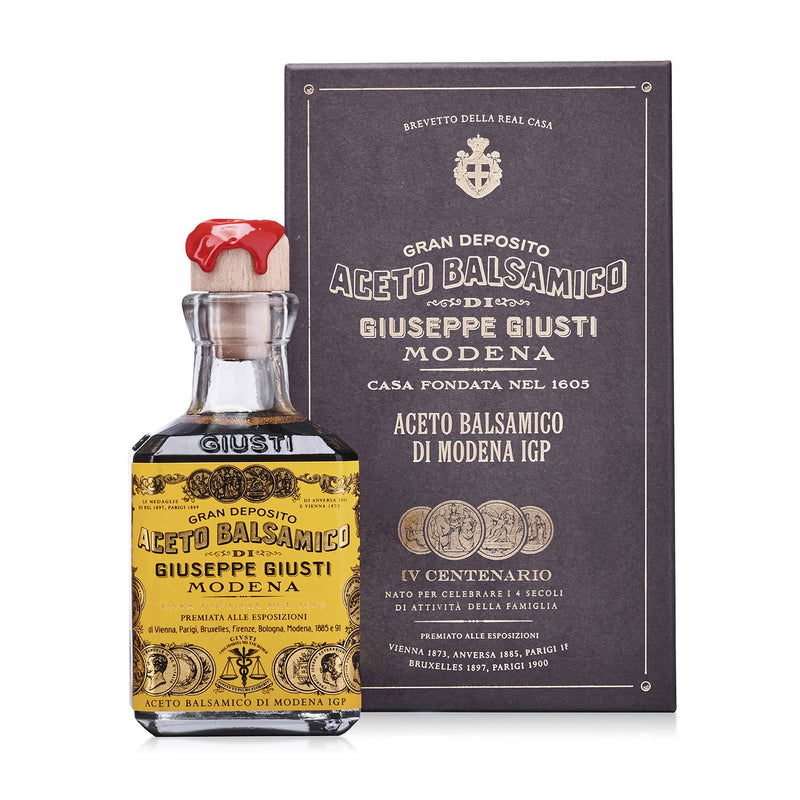 Giusti - 4 Gold Medals Quarto Centenario Balsamic Vinegar in vintage-styled bottle and box with red wax seal, showcasing historic excellence.