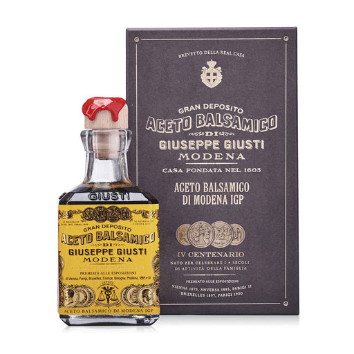 Giusti - 4 Gold Medals Quarto Centenario Balsamic Vinegar in vintage-styled bottle and box with red wax seal, showcasing historic excellence.