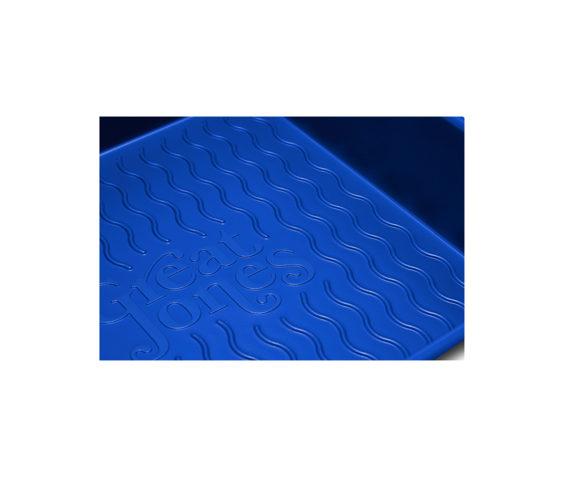 Great Jones | Square One - Blueberry baking pan with a wavy, corrugated bottom, designed for easy release and even baking.