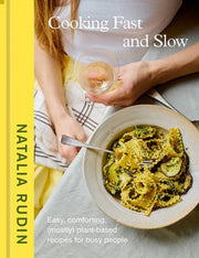 Cover of Penguin Random House LLC - Cooking Fast and Slow by Natalia Rudin, featuring a glass of white wine and leafy-green pasta, emphasizing (mostly) plant-based recipes for busy people.