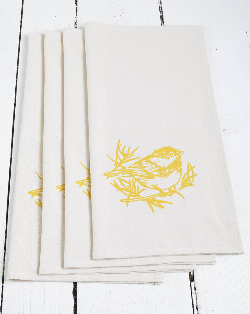Hearth and Harrow - Set of 4 Organic Cotton Chickadee Cloth Napkins in Yellow, featuring a hand-printed mustard yellow bird design, perfect for eco-friendly dining.