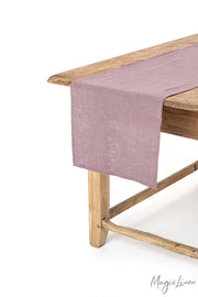 MagicLinen - Linen table runner on wooden table, showcasing soft texture and decorative appeal, ideal for kitchen and dining settings.