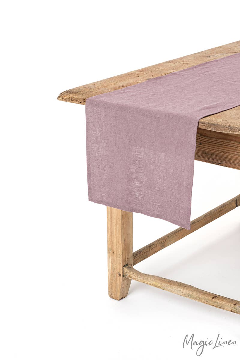 MagicLinen - Linen table runner on wooden table, showcasing soft texture and decorative appeal, ideal for kitchen and dining settings.