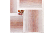 Chilewich | Ombre Rectangle Placemats - Sunrise, featuring a textured weave with a subtle gradient pattern, displayed on a white surface, enhancing any dining setting.