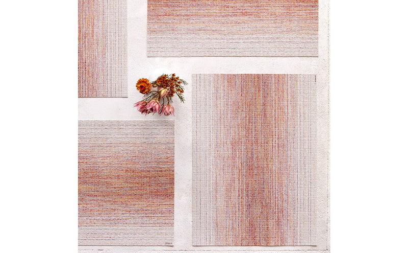 Chilewich | Ombre Rectangle Placemats - Sunrise, featuring a textured weave with a subtle gradient pattern, displayed on a white surface, enhancing any dining setting.