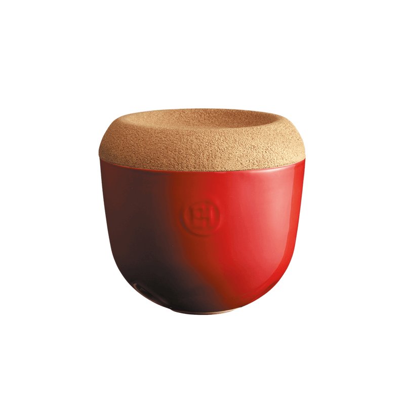 Emile Henry | Garlic Pot, Burgundy: A red ceramic container with cork lid, embossed H logo, designed for storing garlic with ventilation holes and stackable functionality.