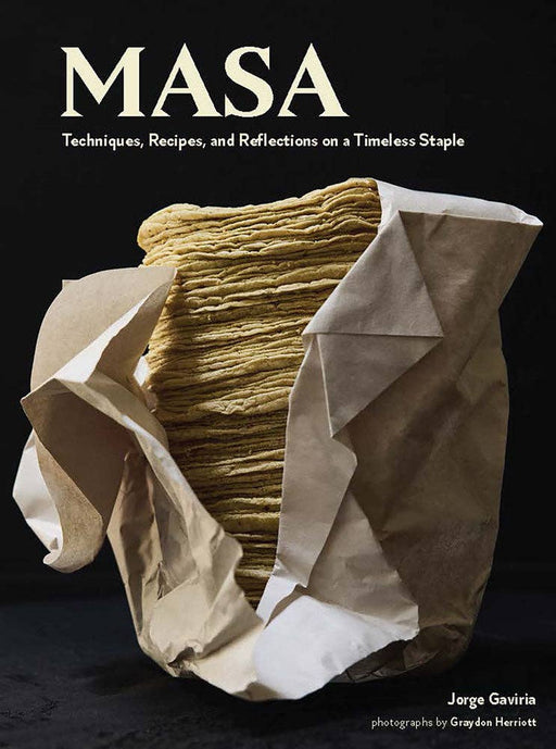 Cookbook cover of Chronicle Books - On Masa featuring a stack of corn tortillas, highlighting masa techniques and recipes by Jorge Gaviria, a renowned culinary guide.
