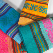 Set of 4 Mexican Servilleta Napkins, showcasing colorful, intricate patterns, perfect for brightening dining tables.