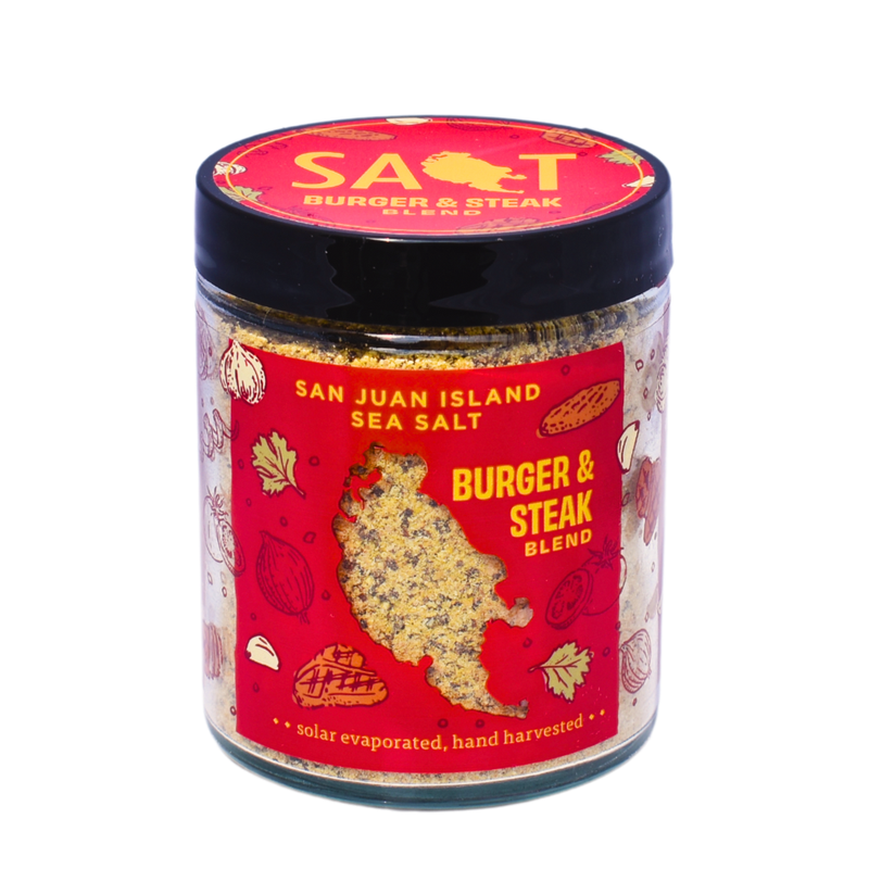 San Juan Island Sea Salt - Burger and Steak Blend in a glass jar, ideal for enhancing meats and versatile for various dishes.